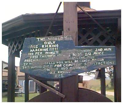 The sign on the World's Only Ass-Kicking Machine